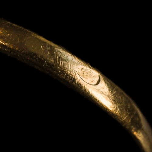 fig 7. An antique late-nineteenth-century French 18k gold navette cluster ring featuring a central oval red ruby surrounded by multiple rose-cut diamonds.