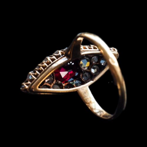 fig 8. An antique late-nineteenth-century French 18k gold navette cluster ring featuring a central oval red ruby surrounded by multiple rose-cut diamonds.