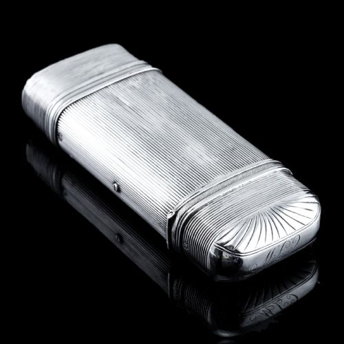 fig 2. A 19th-century Dutch solid silver cigar case featuring a reeded linear texture and rounded ends with fan-shaped engraving.