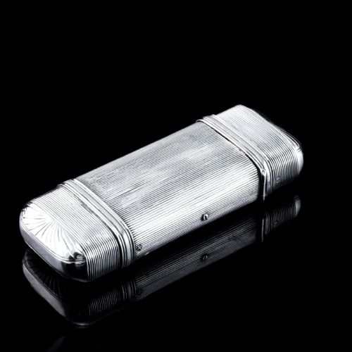 fig 3. A 19th-century Dutch solid silver cigar case featuring a reeded linear texture and rounded ends with fan-shaped engraving.