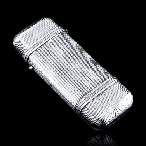 fig 4. A 19th-century Dutch solid silver cigar case featuring a reeded linear texture and rounded ends with fan-shaped engraving.