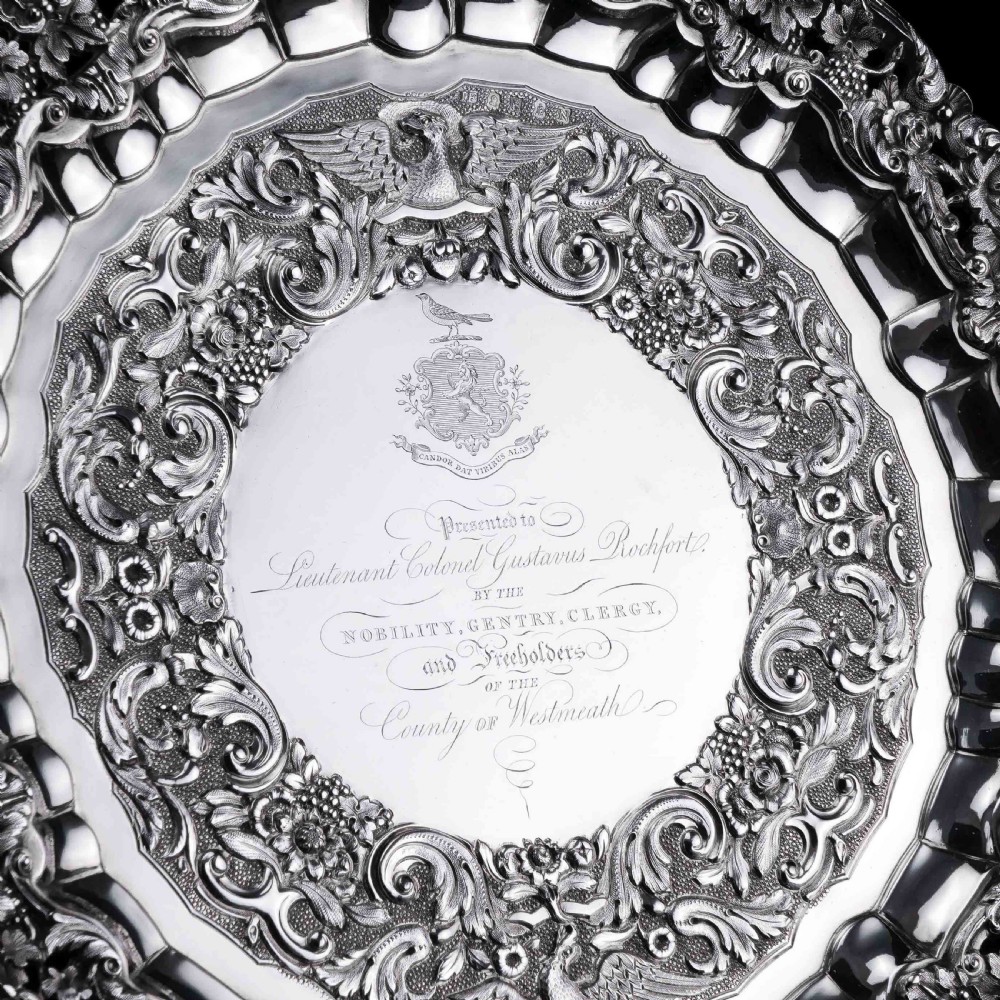 A circular Georgian sterling silver salver featuring an intricately detailed cast floral border and central inscription engraving. View XIII
