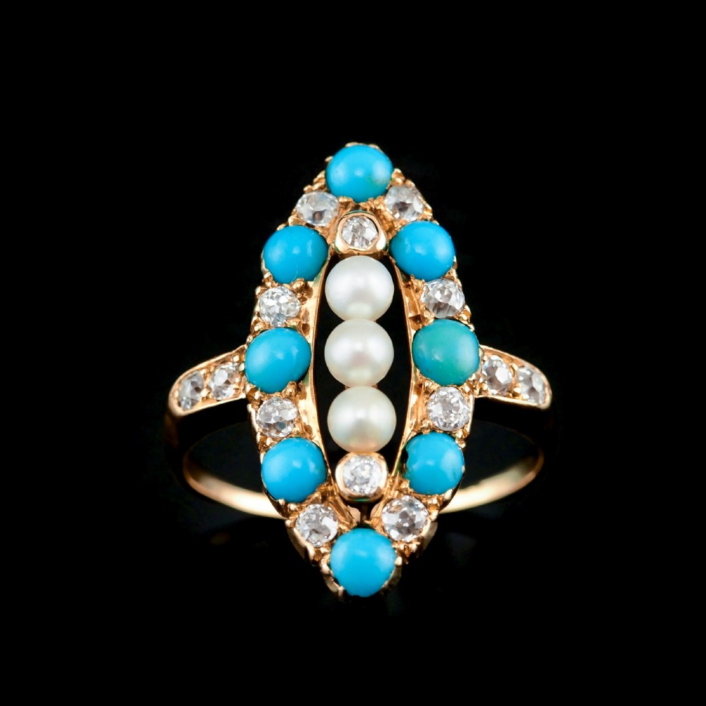 An antique Victorian 18ct yellow gold navette ring featuring three central pearls flanked by turquoise cabochons and old-cut diamonds. View IV