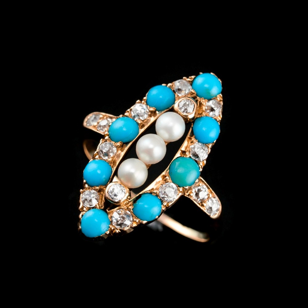 An antique Victorian 18ct yellow gold navette ring featuring three central pearls flanked by turquoise cabochons and old-cut diamonds. View V