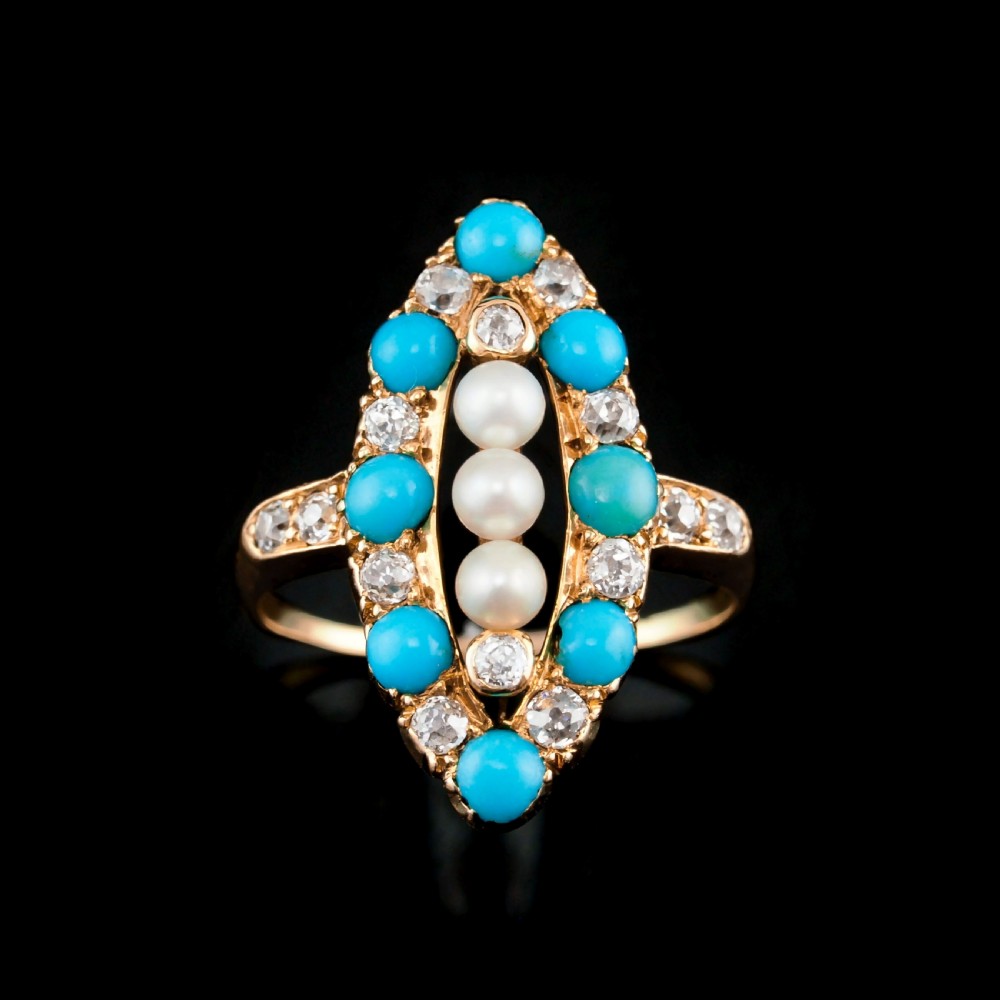 An antique Victorian 18ct yellow gold navette ring featuring three central pearls flanked by turquoise cabochons and old-cut diamonds. View VII