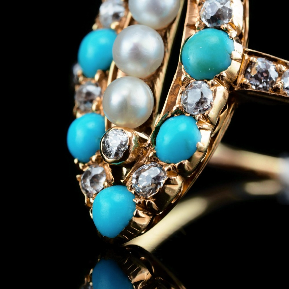 An antique Victorian 18ct yellow gold navette ring featuring three central pearls flanked by turquoise cabochons and old-cut diamonds. View VIII
