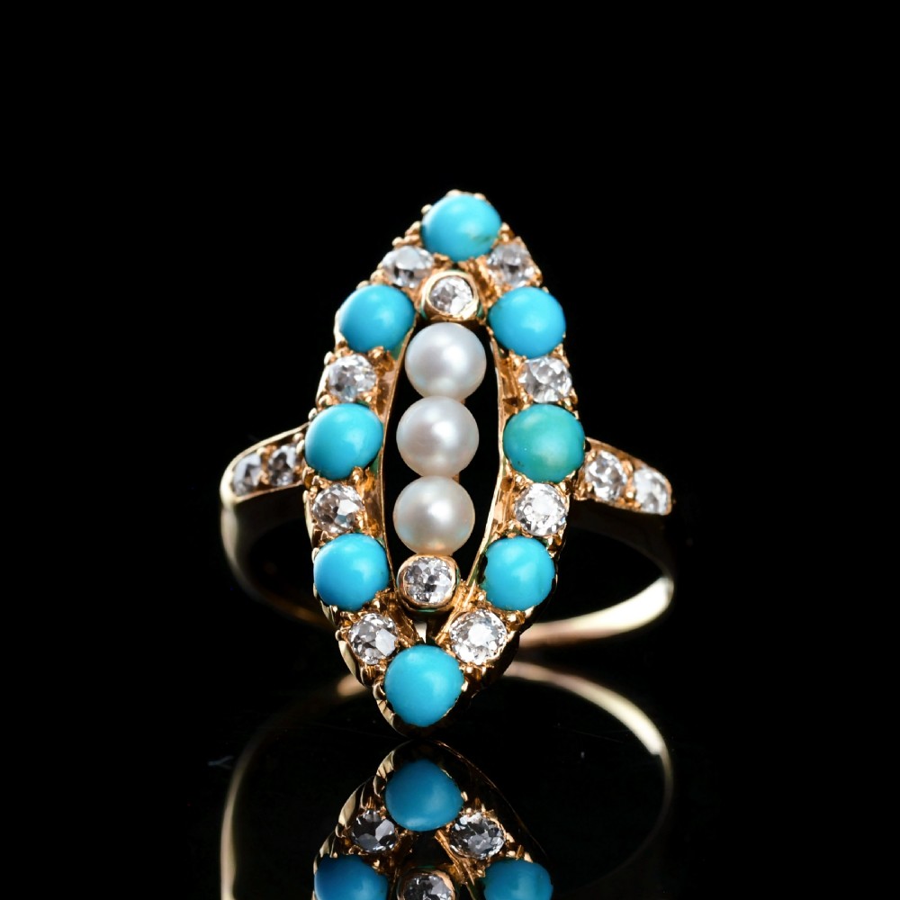 An antique Victorian 18ct yellow gold navette ring featuring three central pearls flanked by turquoise cabochons and old-cut diamonds. View X