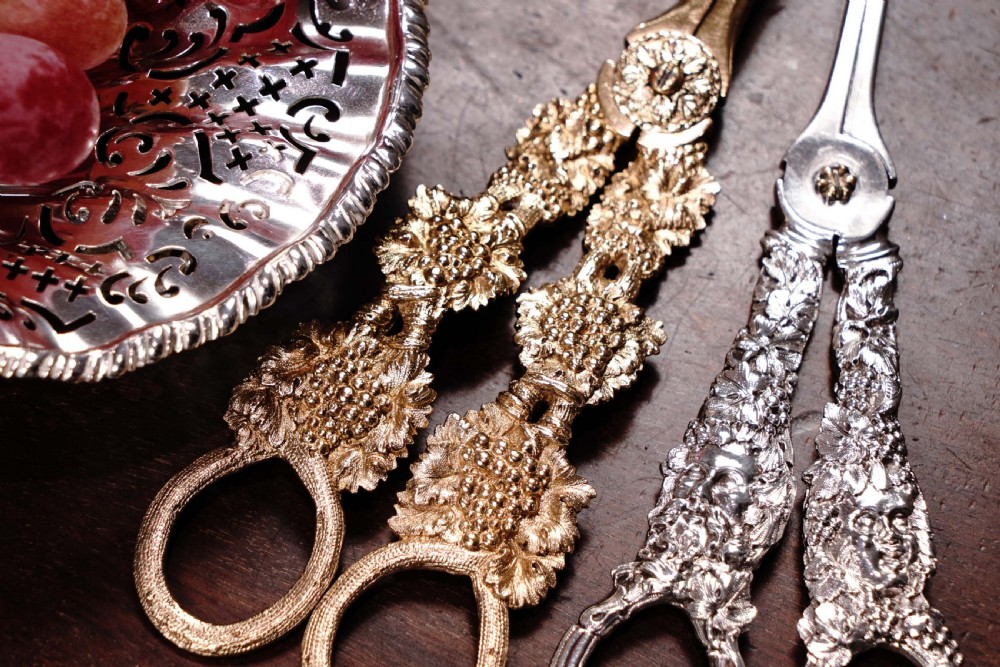 A pair of Georgian solid silver gilt grape shears featuring cast grapevine handle motifs. View XXX