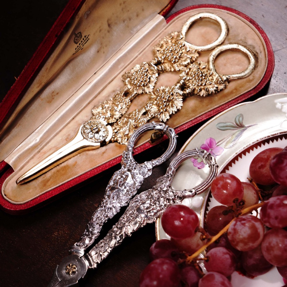 A pair of Georgian solid silver gilt grape shears featuring cast grapevine handle motifs. View XXXI
