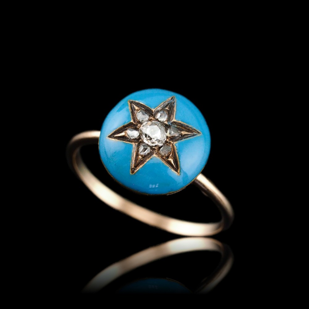 A 9ct yellow gold ring featuring a bright blue enamel dome set with a central six-pointed diamond star motif. View II