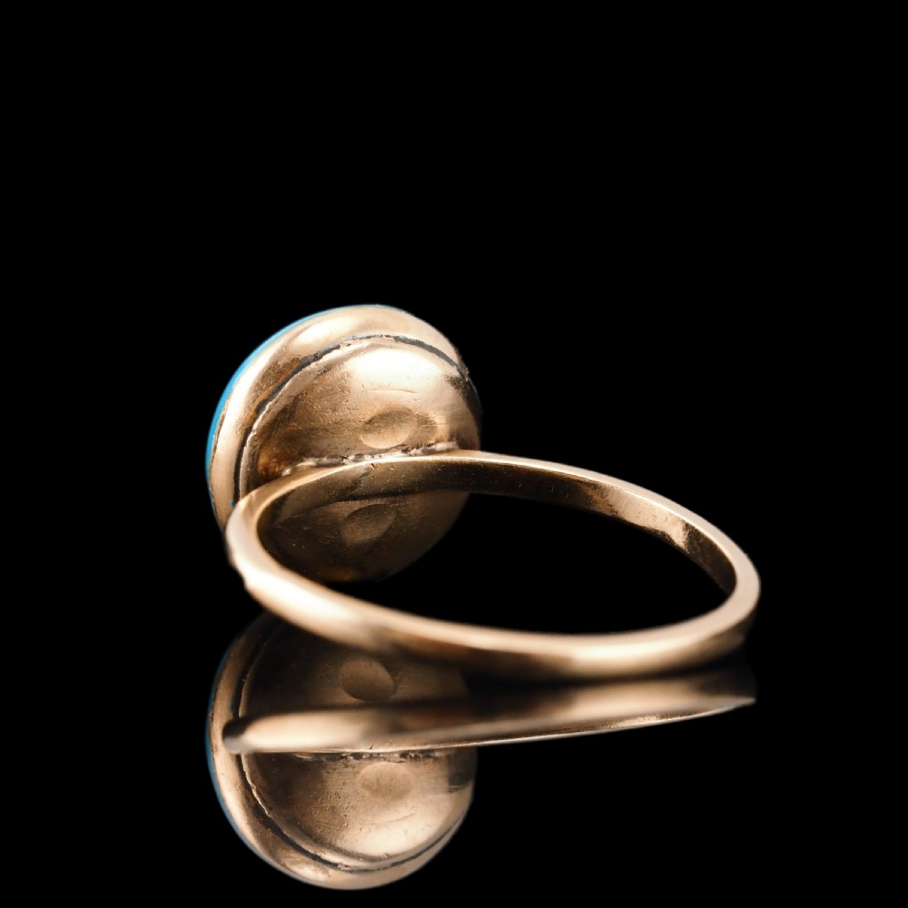 A 9ct yellow gold ring featuring a bright blue enamel dome set with a central six-pointed diamond star motif. View XX