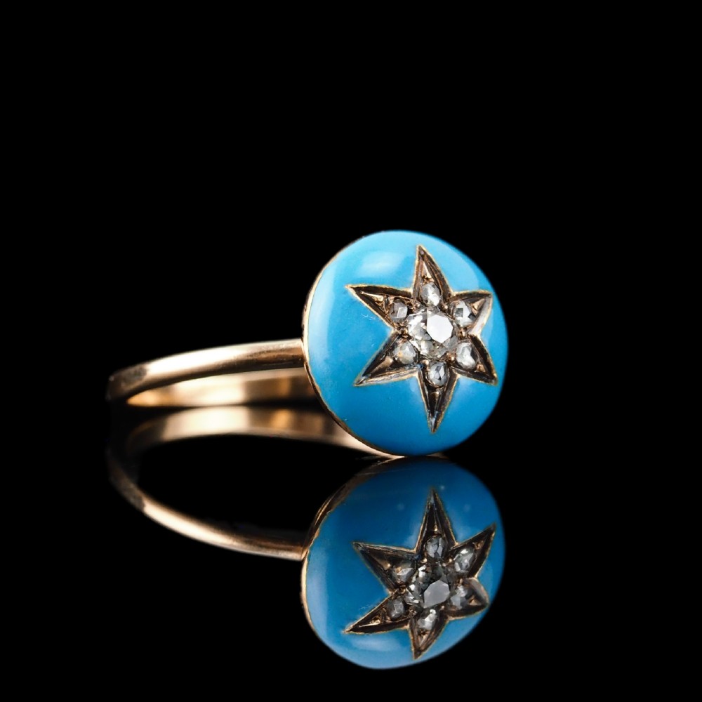 A 9ct yellow gold ring featuring a bright blue enamel dome set with a central six-pointed diamond star motif. View XXIII