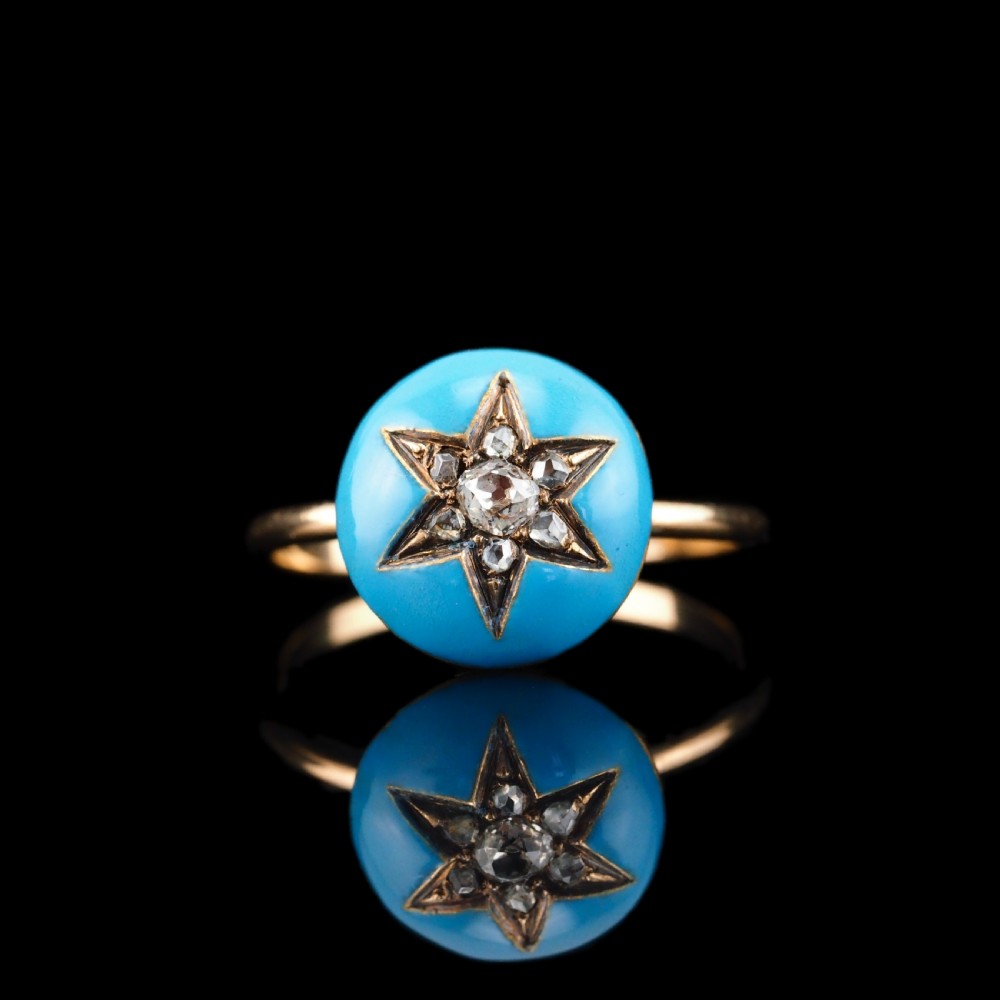 A 9ct yellow gold ring featuring a bright blue enamel dome set with a central six-pointed diamond star motif. View XXIV