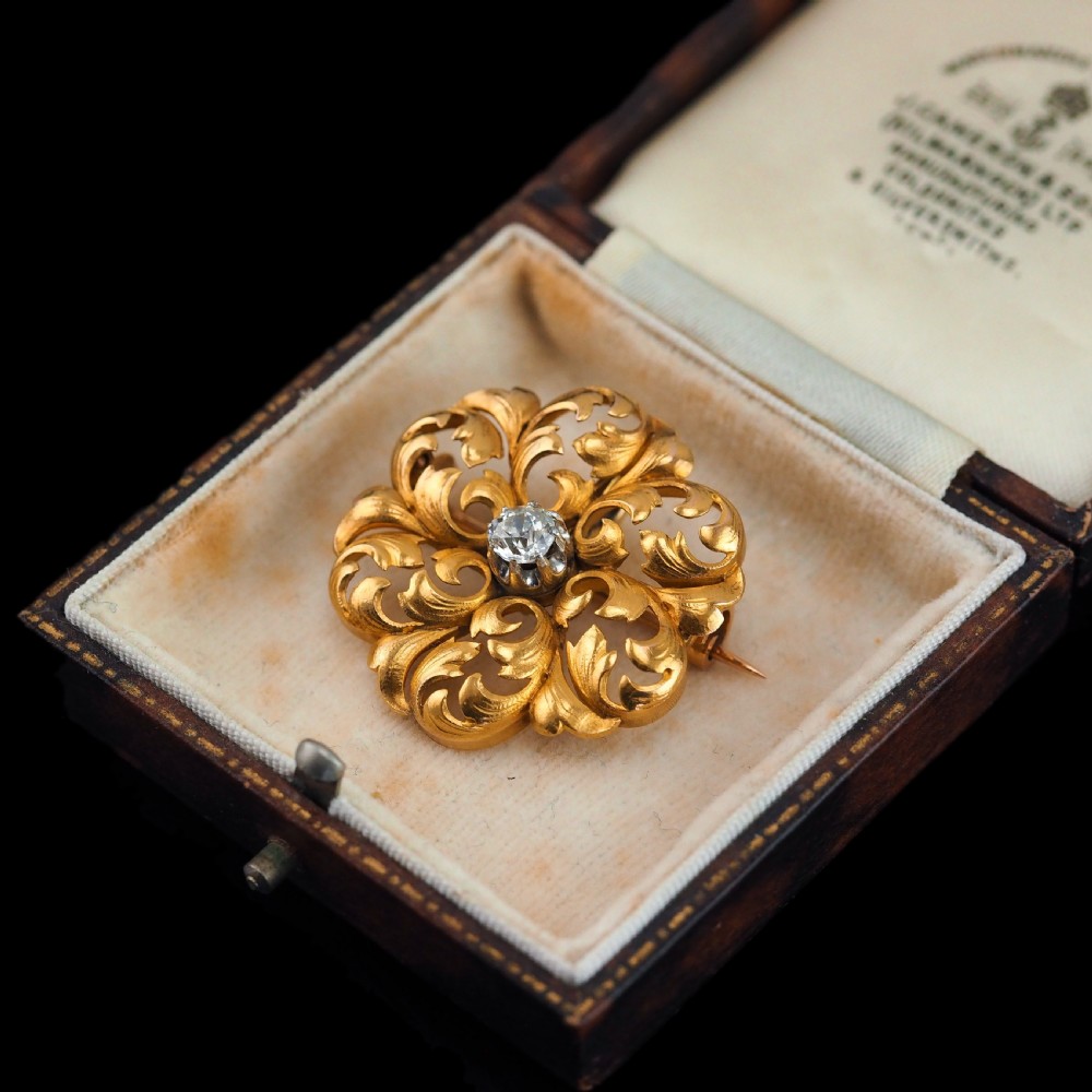 An 18ct yellow gold Victorian pendant brooch with openwork acanthus leaf scrollwork and a central round diamond. View III