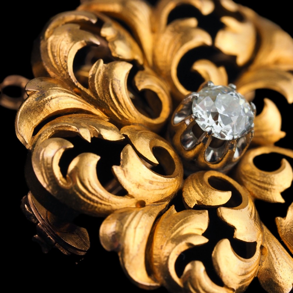 An 18ct yellow gold Victorian pendant brooch with openwork acanthus leaf scrollwork and a central round diamond. View XI
