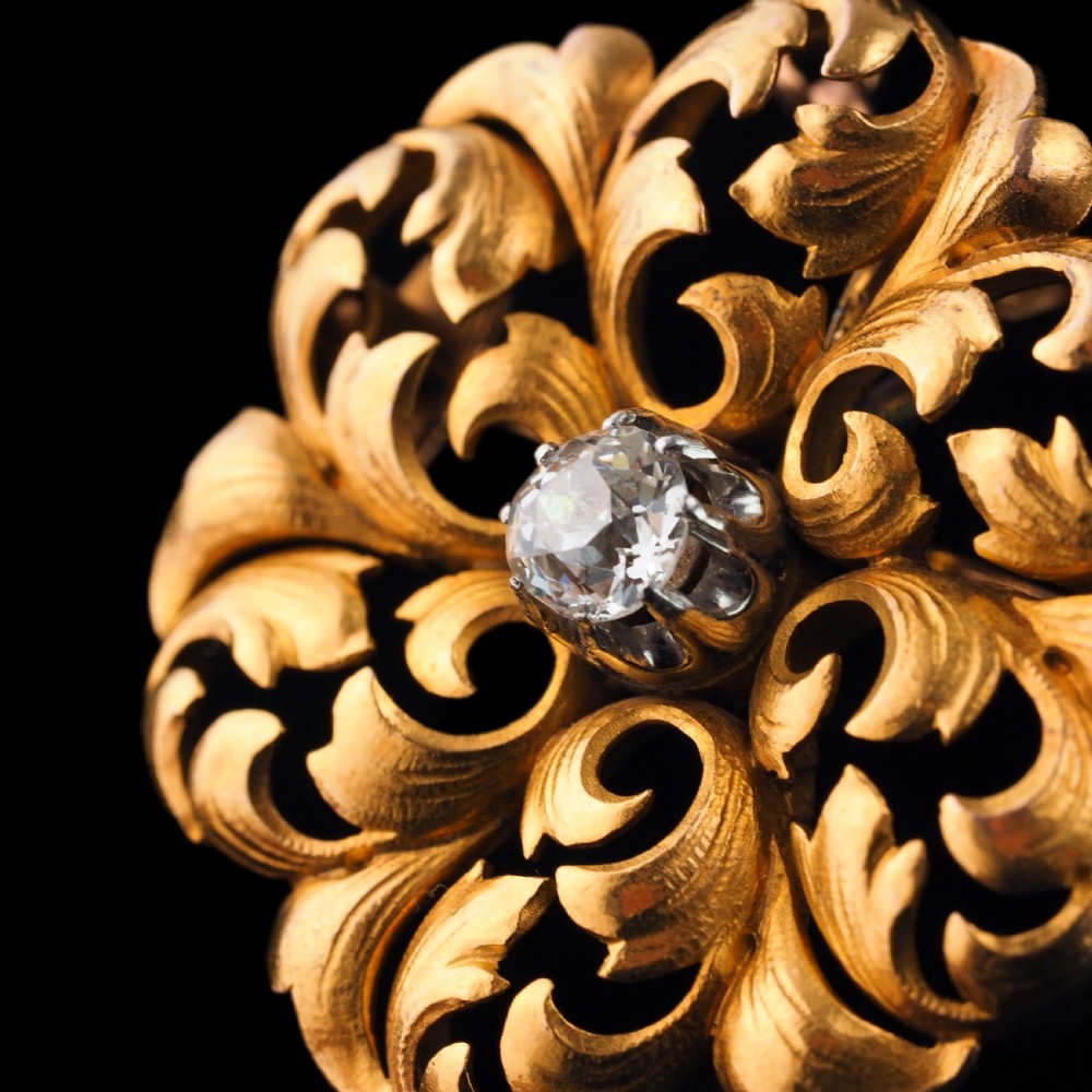 An 18ct yellow gold Victorian pendant brooch with openwork acanthus leaf scrollwork and a central round diamond. View XIII