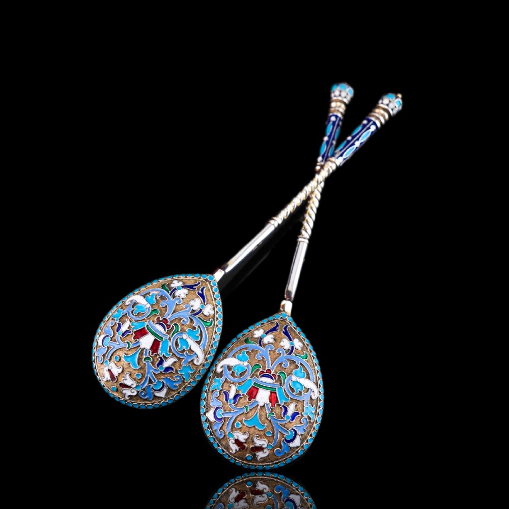 A pair of late nineteenth century Russian solid silver spoons featuring floral cloisonne enamel in turquoise, blue, red, and white on gilded teardrop bowls with twisted handles. View XI