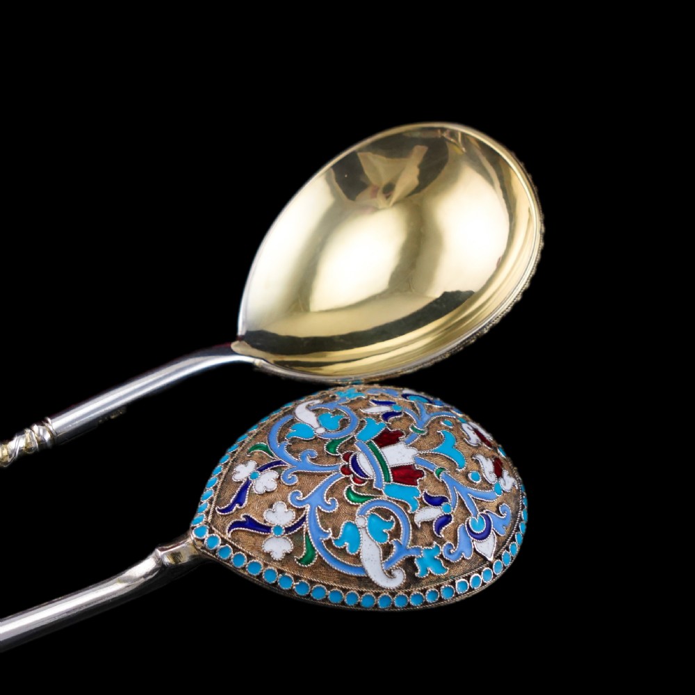 A pair of late nineteenth century Russian solid silver spoons featuring floral cloisonne enamel in turquoise, blue, red, and white on gilded teardrop bowls with twisted handles. View XXIII