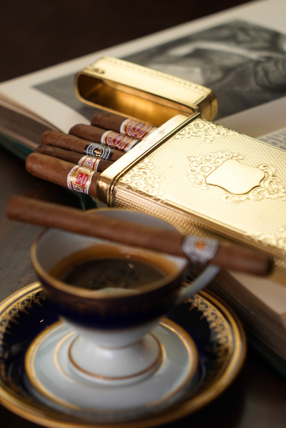An antique Victorian sterling silver gilt cigar case featuring fine engine-turned texturing, scroll engraving, and a central unengraved cartouche. View II