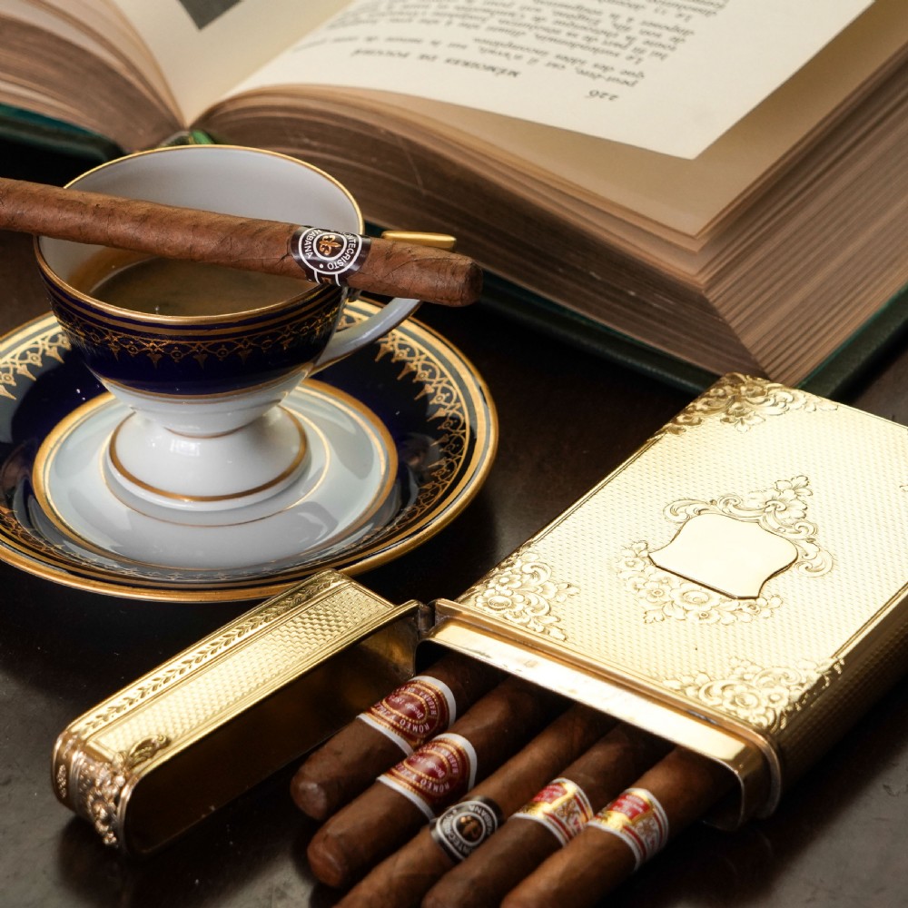 An antique Victorian sterling silver gilt cigar case featuring fine engine-turned texturing, scroll engraving, and a central unengraved cartouche. View VI