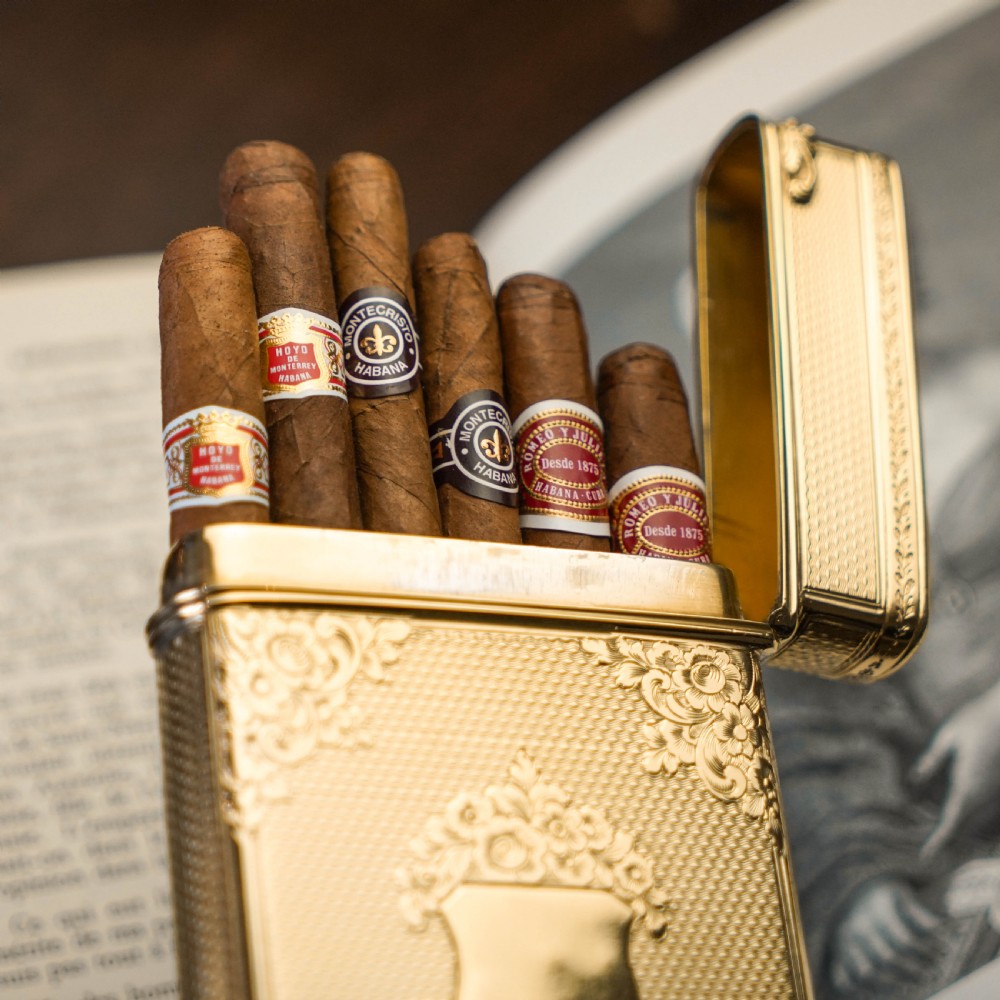 An antique Victorian sterling silver gilt cigar case featuring fine engine-turned texturing, scroll engraving, and a central unengraved cartouche. View VIII