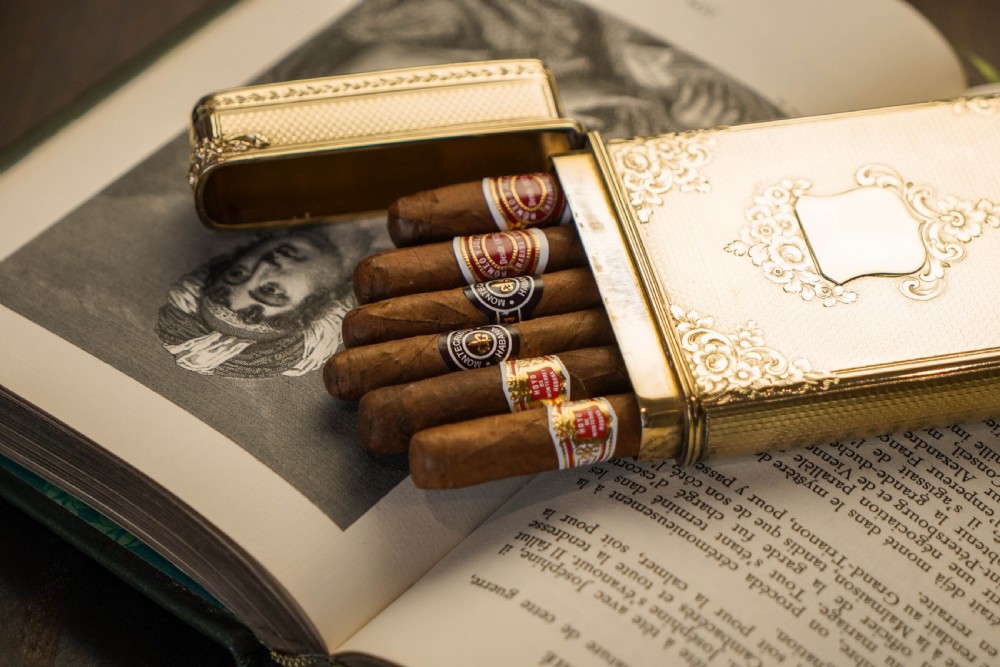 An antique Victorian sterling silver gilt cigar case featuring fine engine-turned texturing, scroll engraving, and a central unengraved cartouche. View IX