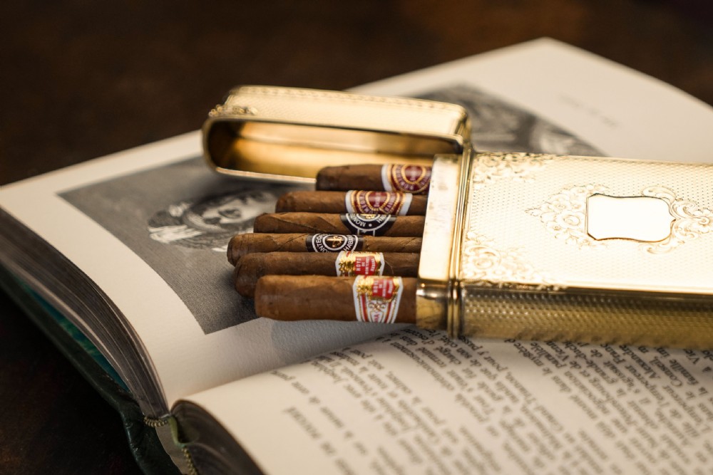 An antique Victorian sterling silver gilt cigar case featuring fine engine-turned texturing, scroll engraving, and a central unengraved cartouche. View X