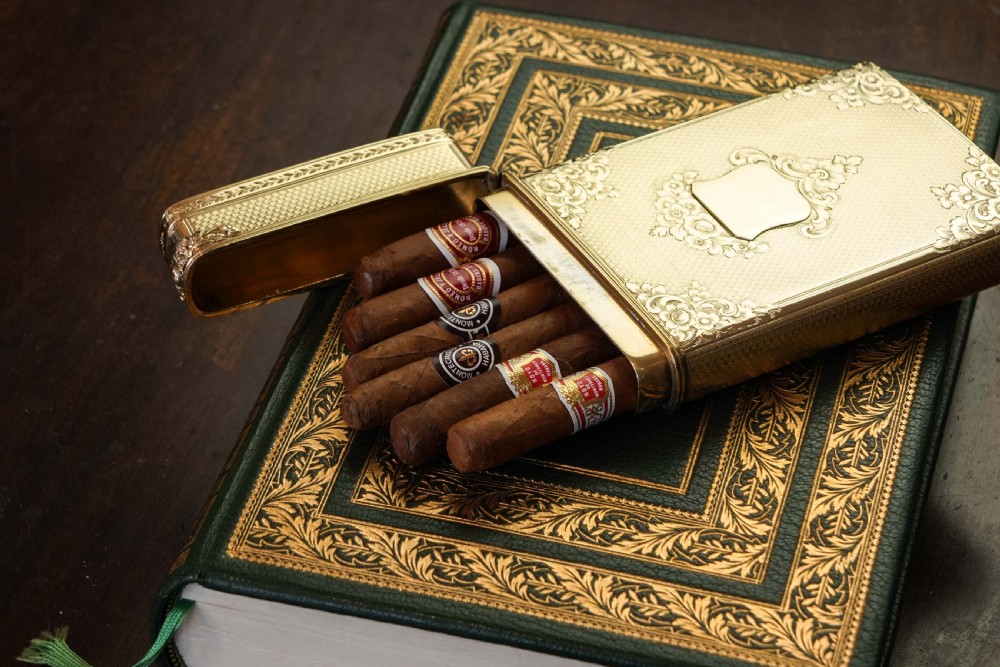 An antique Victorian sterling silver gilt cigar case featuring fine engine-turned texturing, scroll engraving, and a central unengraved cartouche. View XI