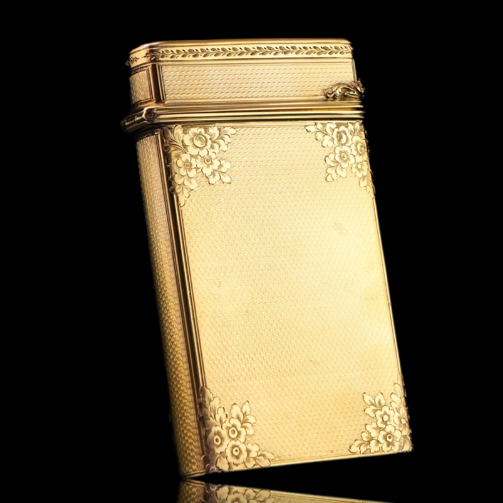 An antique Victorian sterling silver gilt cigar case featuring fine engine-turned texturing, scroll engraving, and a central unengraved cartouche. View XIV