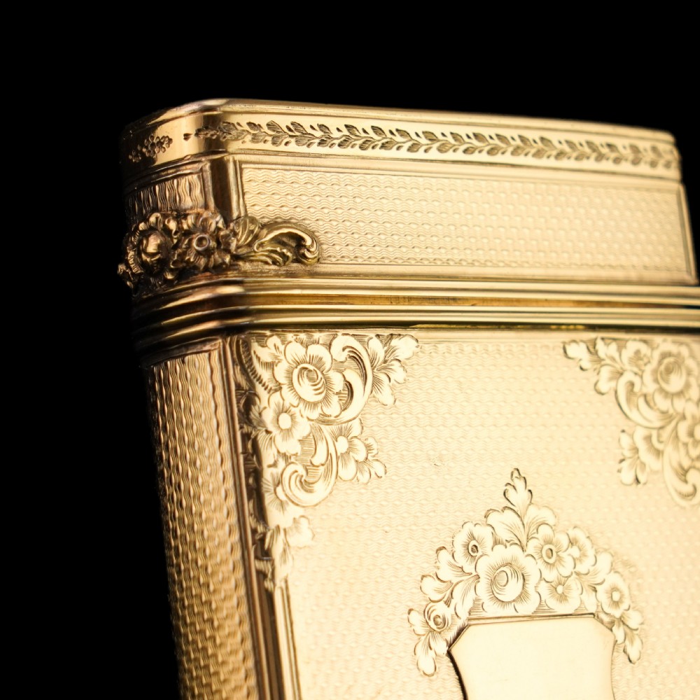An antique Victorian sterling silver gilt cigar case featuring fine engine-turned texturing, scroll engraving, and a central unengraved cartouche. View XVIII