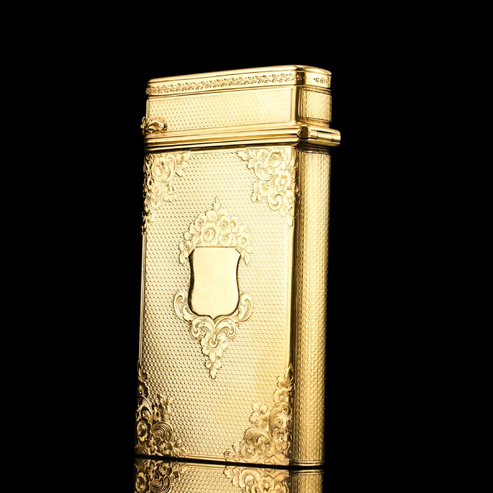 An antique Victorian sterling silver gilt cigar case featuring fine engine-turned texturing, scroll engraving, and a central unengraved cartouche. View XX