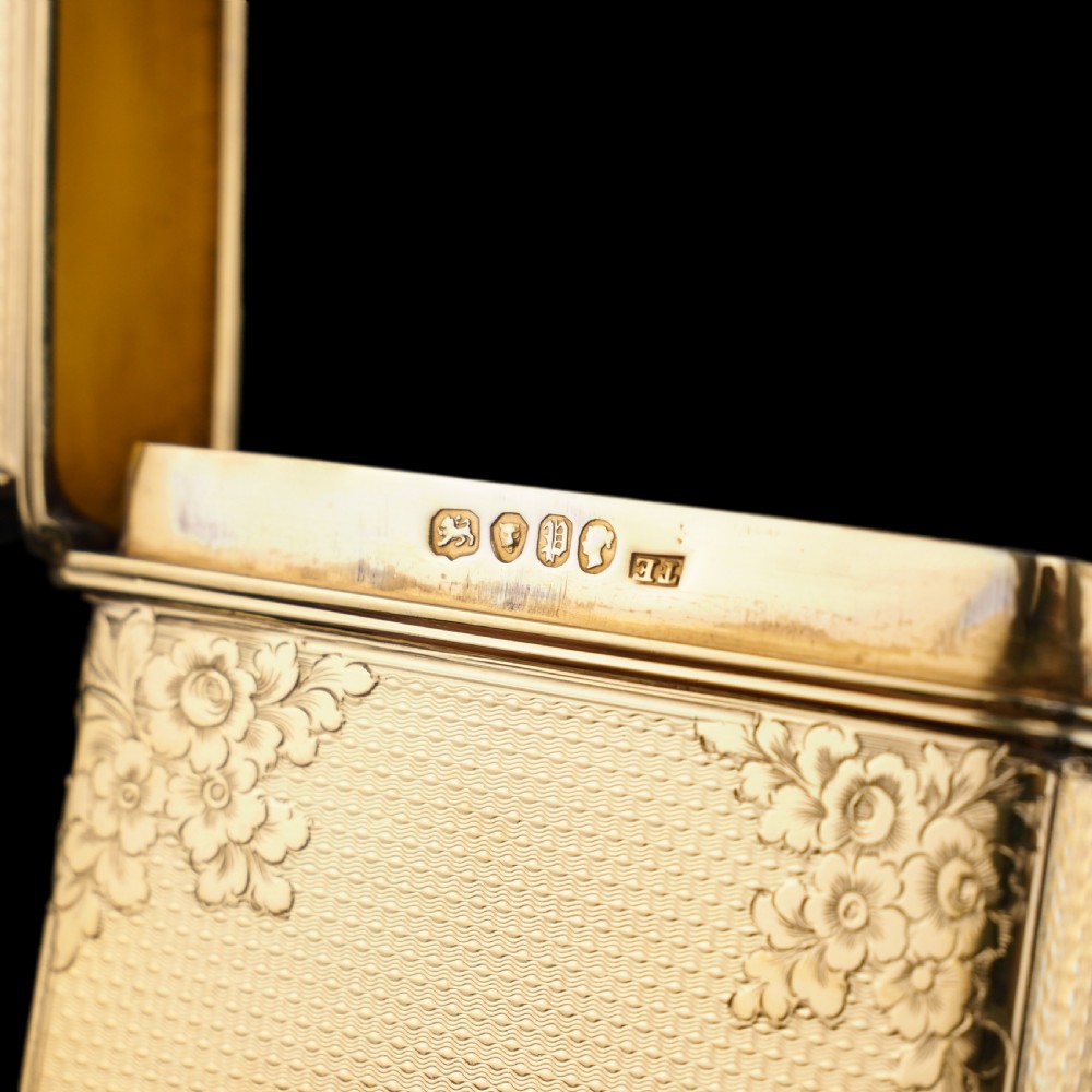 An antique Victorian sterling silver gilt cigar case featuring fine engine-turned texturing, scroll engraving, and a central unengraved cartouche. View XXIII