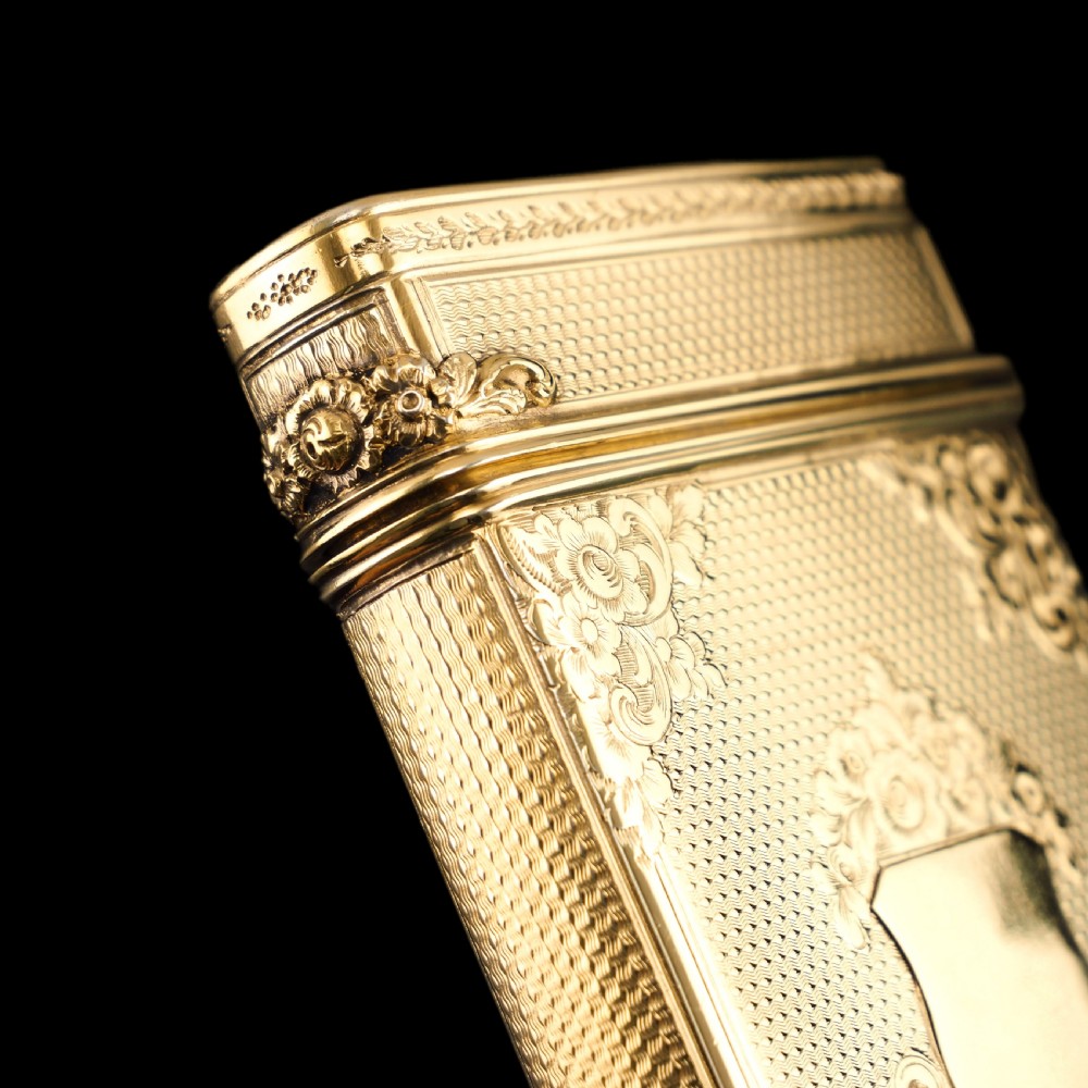 An antique Victorian sterling silver gilt cigar case featuring fine engine-turned texturing, scroll engraving, and a central unengraved cartouche. View XXV