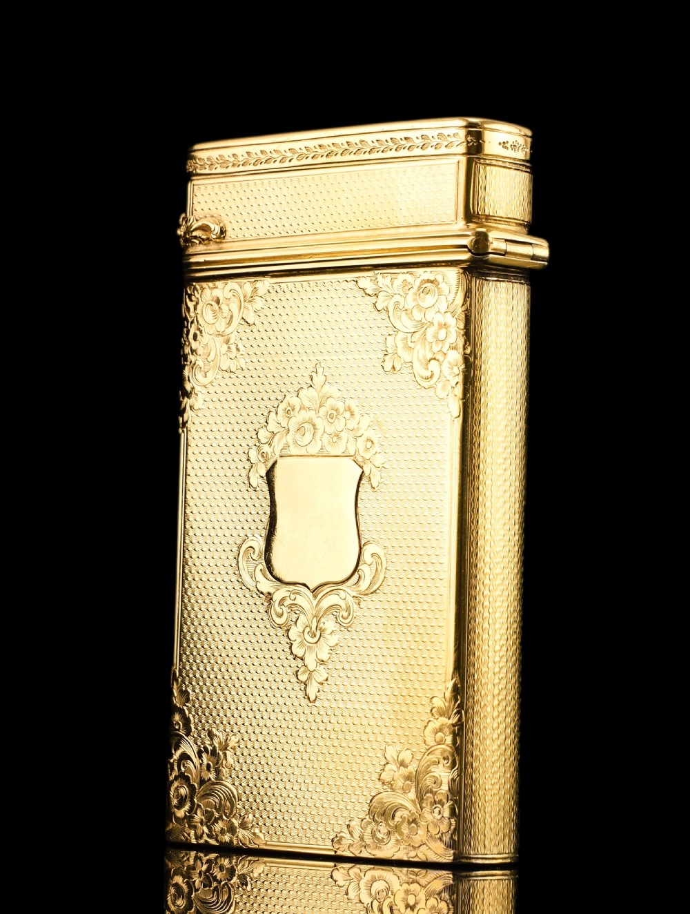 An antique Victorian sterling silver gilt cigar case featuring fine engine-turned texturing, scroll engraving, and a central unengraved cartouche. View XXIX