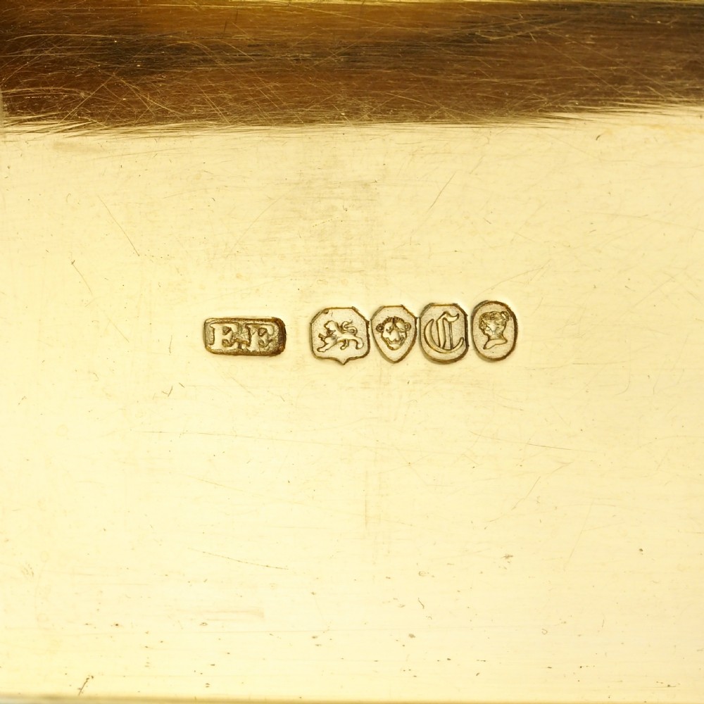 A rectangular Victorian sterling silver snuff box with an open hinged lid, engine-turned engraving, cast acanthus leaf border, and a gilt interior. View XVI