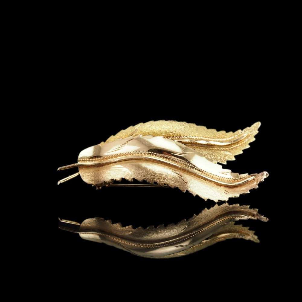 A Stylish 18ct Gold Feather Brooch With Twin Textured Design View XXI