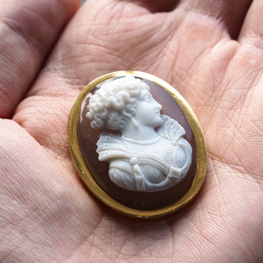 An oval Victorian brooch featuring a white hand-carved agate female portrait profile set within a smooth 18ct yellow gold frame. View III