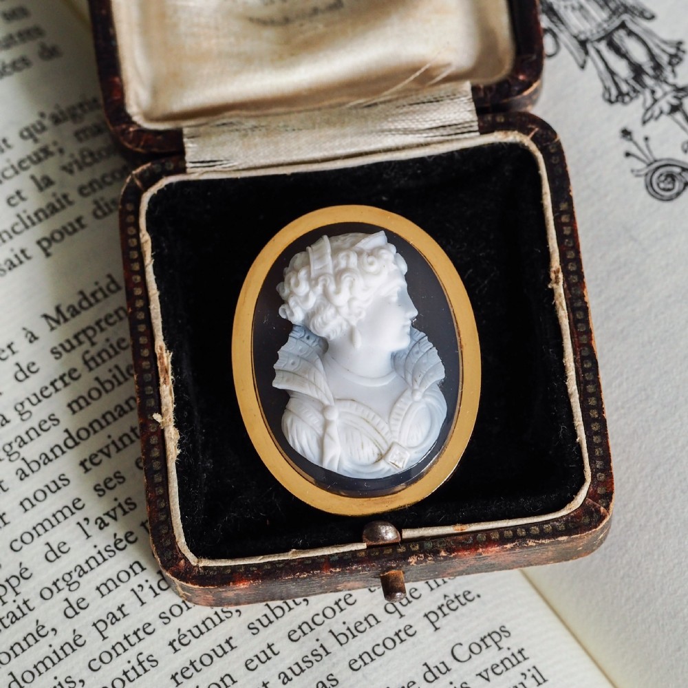 An oval Victorian brooch featuring a white hand-carved agate female portrait profile set within a smooth 18ct yellow gold frame. View XXII
