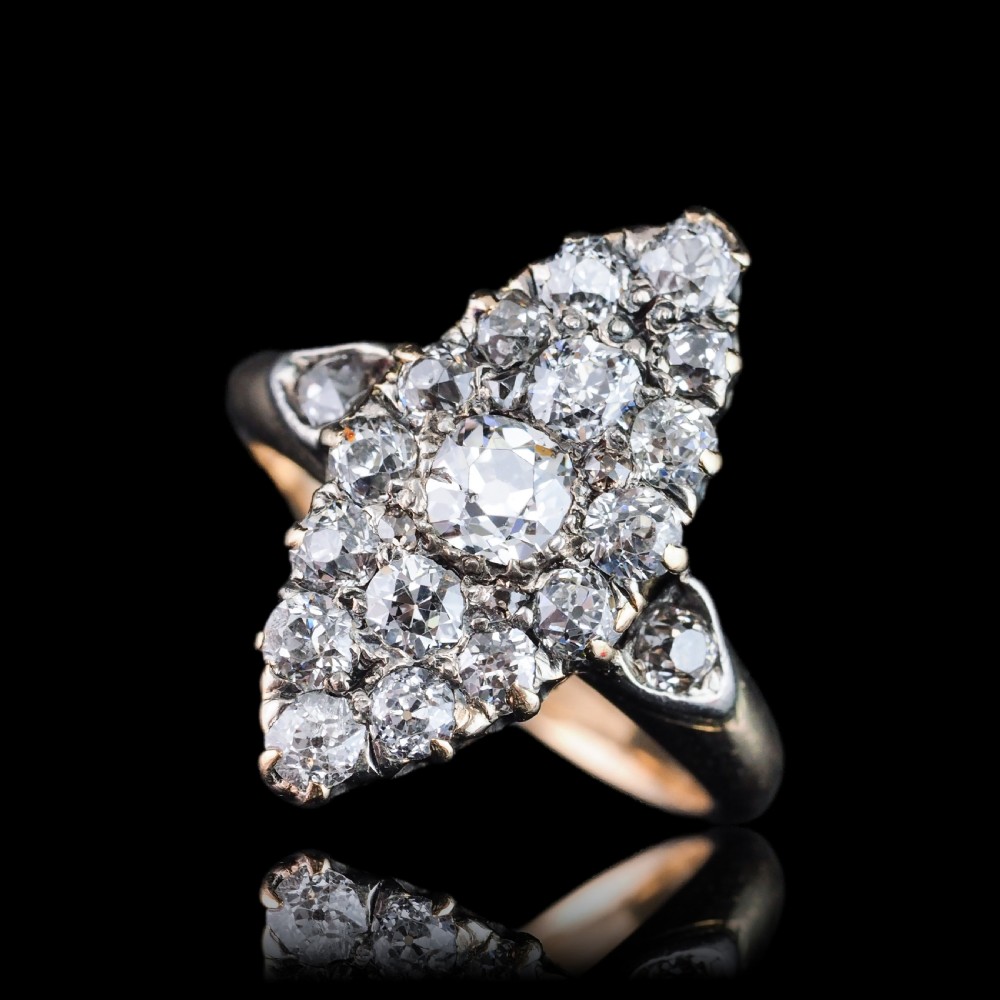 A late Victorian yellow gold and diamond navette cluster ring featuring hand-cut diamonds set in an elongated marquise shape. View III