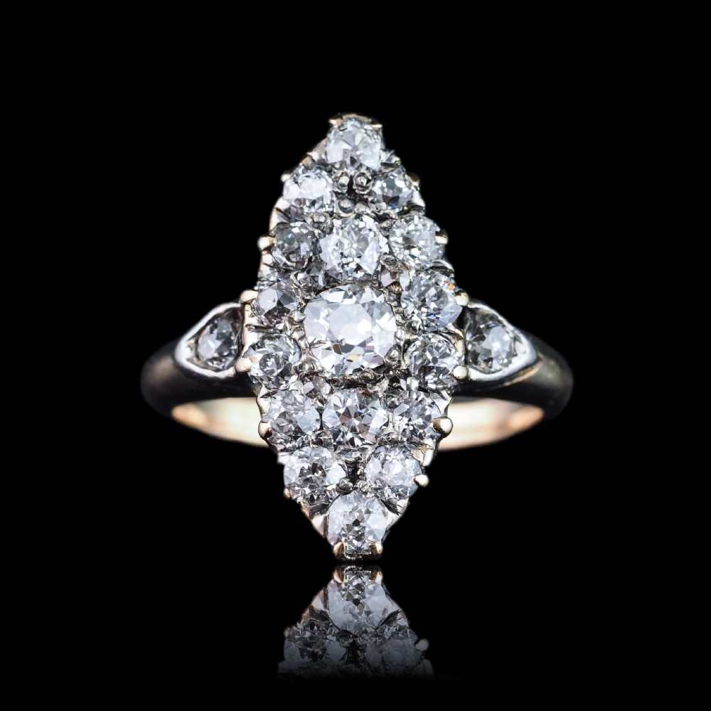 A late Victorian yellow gold and diamond navette cluster ring featuring hand-cut diamonds set in an elongated marquise shape. View V