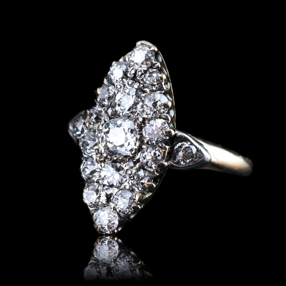 A late Victorian yellow gold and diamond navette cluster ring featuring hand-cut diamonds set in an elongated marquise shape. View VII