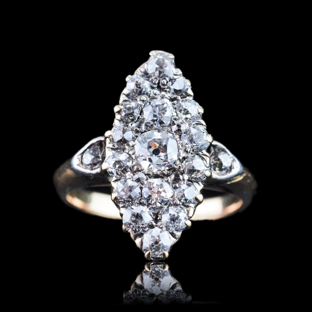 A late Victorian yellow gold and diamond navette cluster ring featuring hand-cut diamonds set in an elongated marquise shape. View VIII