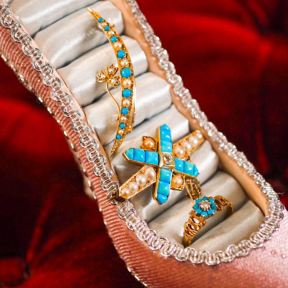 A Victorian 15ct yellow gold crescent brooch set with alternating turquoise cabochons and split pearls, featuring an offset diamond trefoil motif. View III