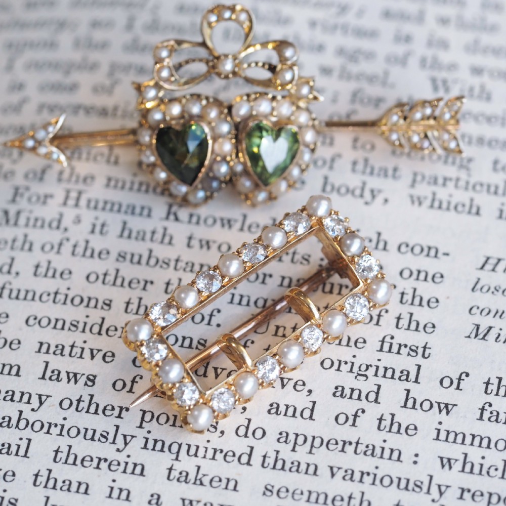 An antique Victorian rectangular buckle-shaped brooch in 18-carat yellow gold, set with alternating diamonds and natural pearls. View II