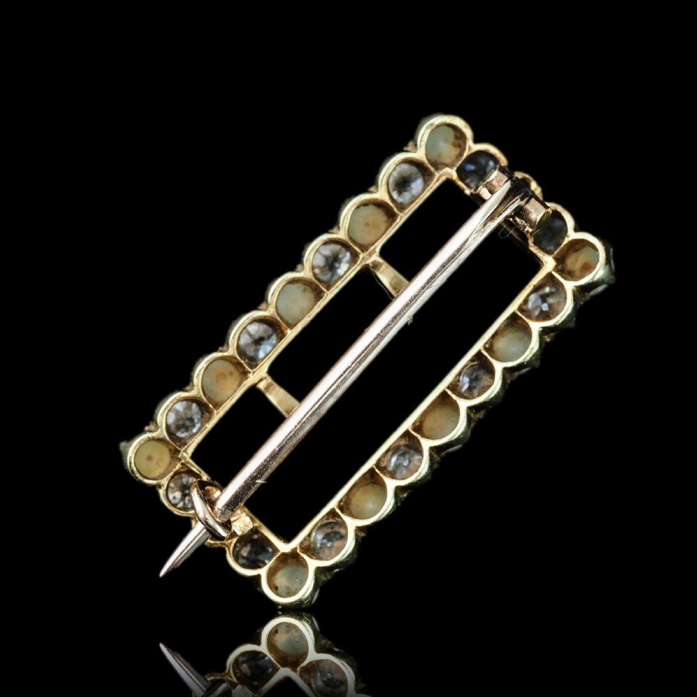 An antique Victorian rectangular buckle-shaped brooch in 18-carat yellow gold, set with alternating diamonds and natural pearls. View XVIII