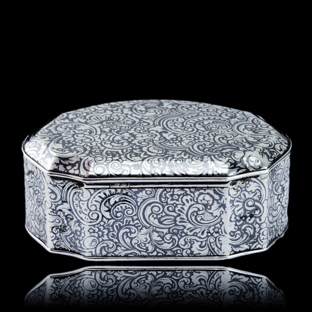 An antique French solid silver snuff box with black niello scrollwork engraving and a gilded gold interior. View XXIII