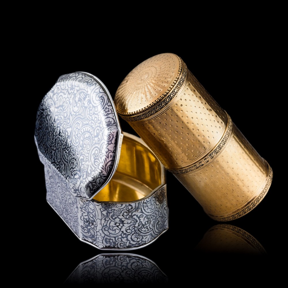 A small cylindrical French silver gilt etui featuring intricate engine-turned guilloche wave patterns and textured borders. View V