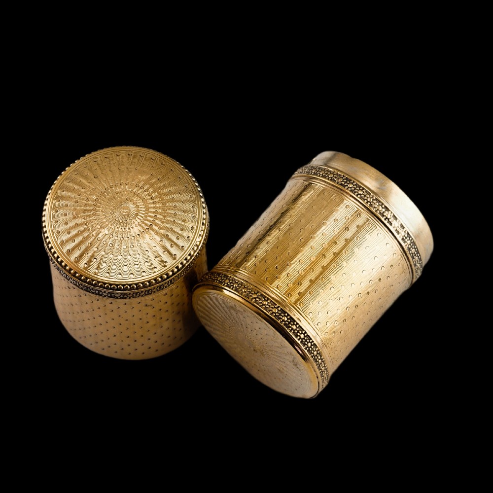 A small cylindrical French silver gilt etui featuring intricate engine-turned guilloche wave patterns and textured borders. View XII