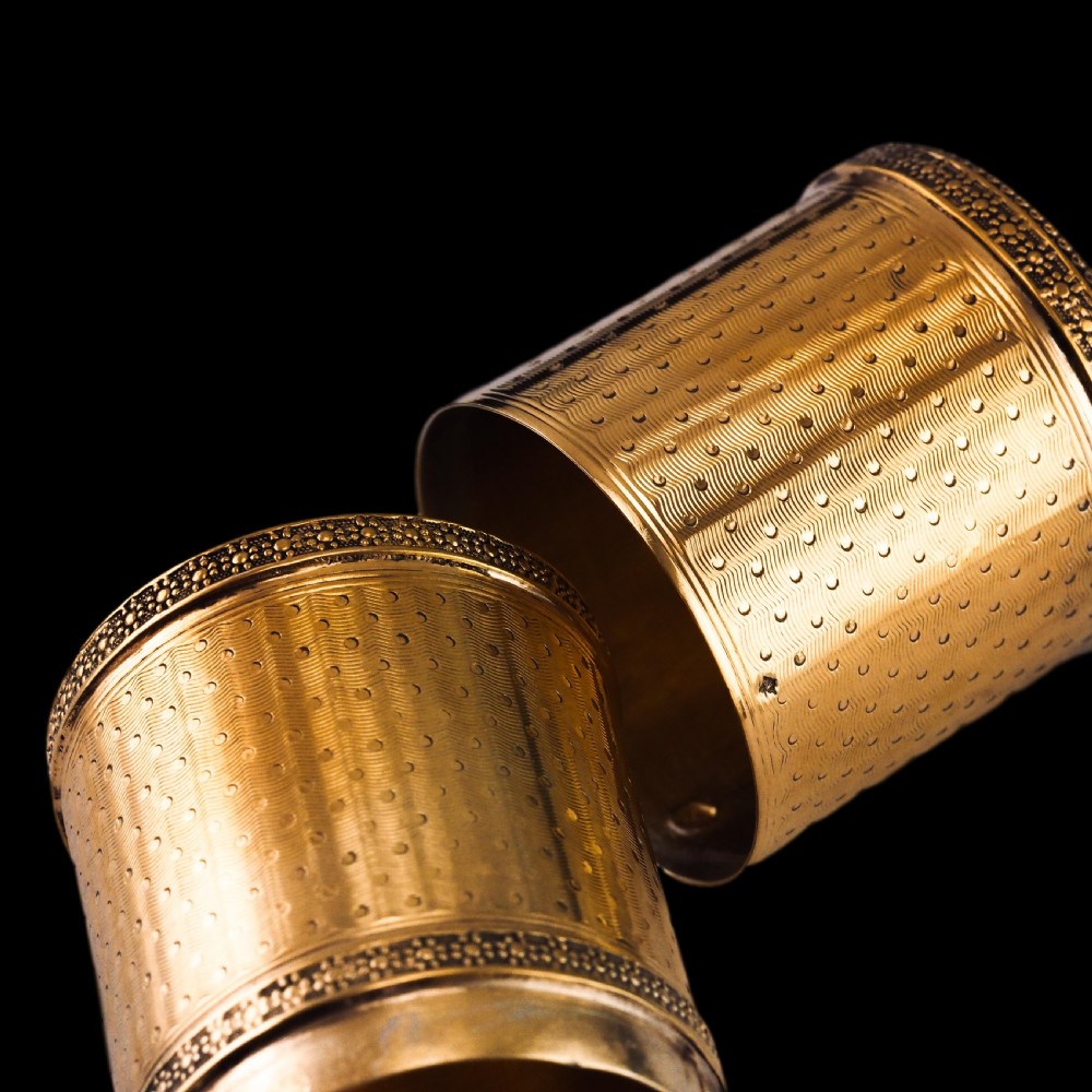 A small cylindrical French silver gilt etui featuring intricate engine-turned guilloche wave patterns and textured borders. View XIII