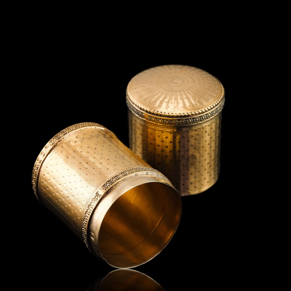 A small cylindrical French silver gilt etui featuring intricate engine-turned guilloche wave patterns and textured borders. View XV